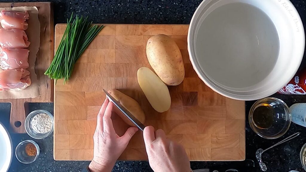 Top down image showing potato being cut into 8ths.