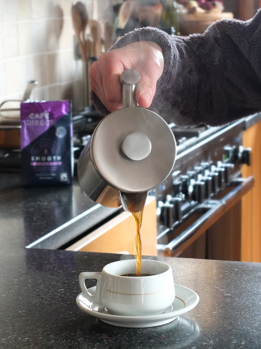 Image of man pouring coffee from a cafetiere.