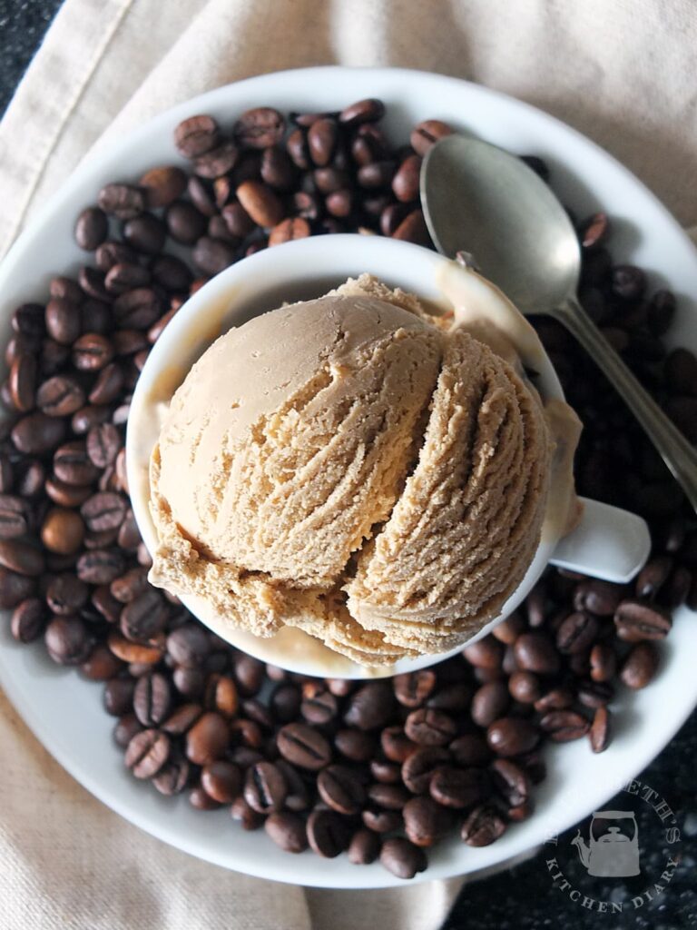 Top down image of a scoop of coffee ice cream in an espresso cup.