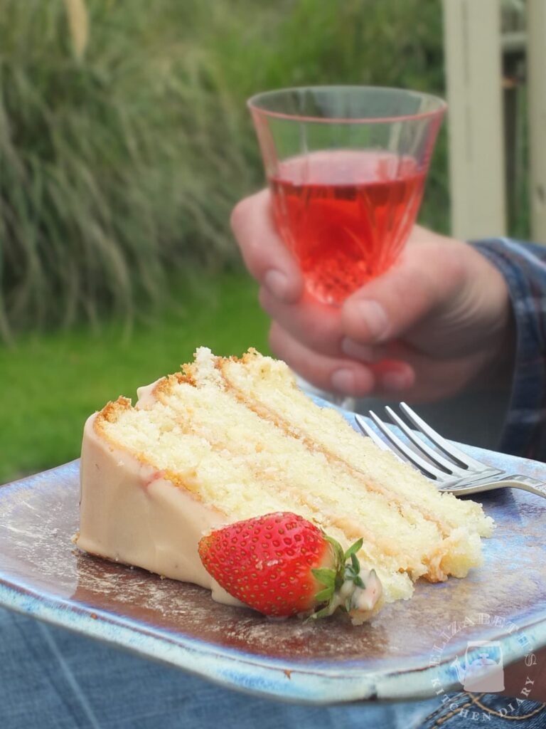 Close up image of a slice of strawberry and thyme birthday cake.