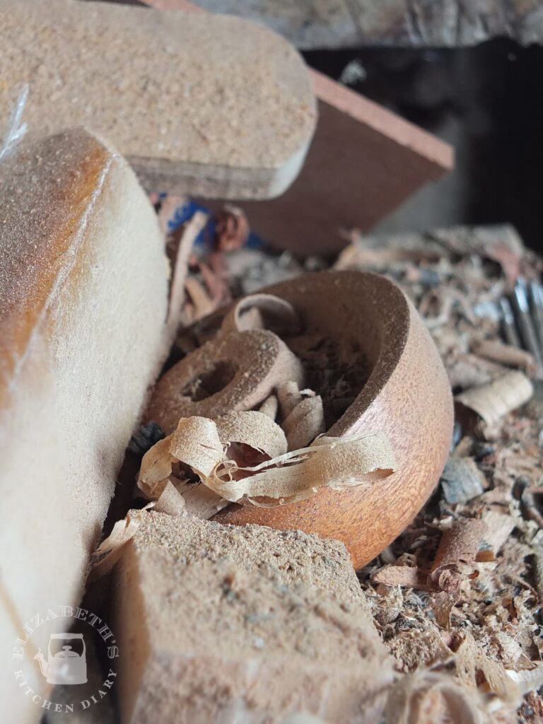 Close up image of sawdust and wood turning shavings.