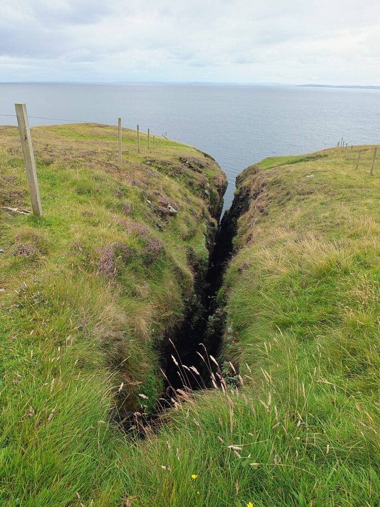 Image of Longriva, a very narrow cleft about 600 feet long with a rather long drop down into the sea.
