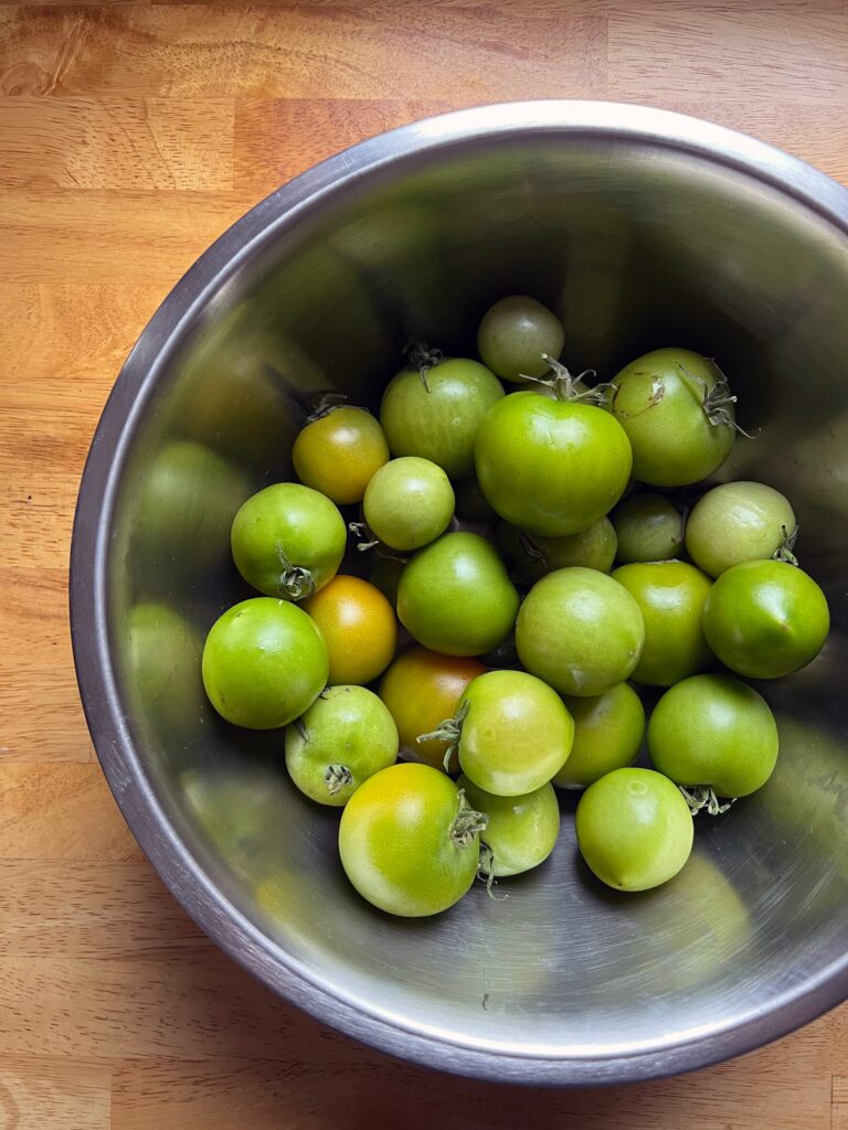 Image of green tomatoes in a bowl. These tomatoes are the last tomatoes  of the tomatoes grown by my dear friend's father who passed away earlier this year.
