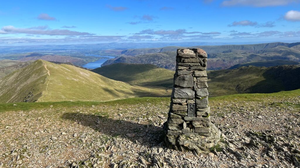 Image of the trig point on top of Helvellyn.