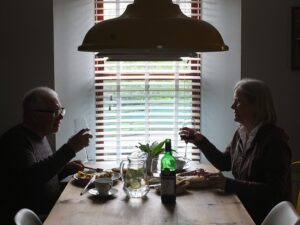 Silhouette of a couple enjoying a leisurely brunch.