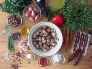 Top down image of all the ingredients needed to make vegan mushroom bourguignon.