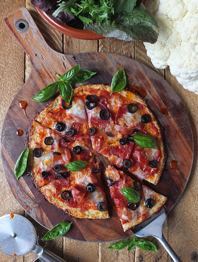 This low carb, high protein, gluten free cauliflower pizza crust has only 220 calories for a whole pizza!